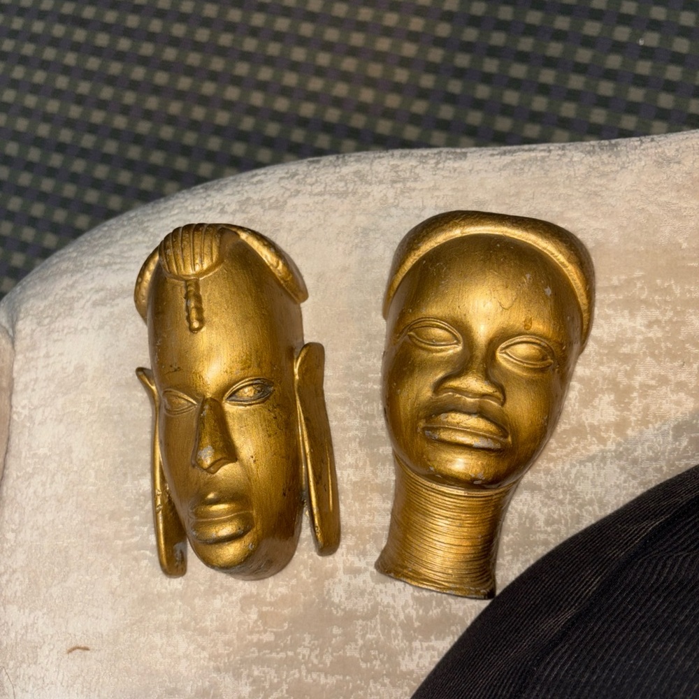 Pair of Gold African Face Sculptures
